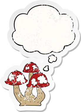 Düşünce baloncuklu mantarlar insan tarafından çizilmiş yıpranmış bir çıkartma.