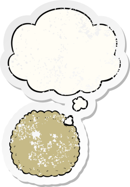 Düşünce baloncuklu çizgi film bisküvisi insan tarafından çizilmiş yıpranmış bir çıkartma.