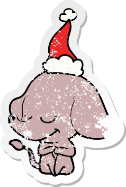 Bir insan tarafından çizilmiş Noel Baba şapkası giymiş gülümseyen bir filin kederli çıkartması.