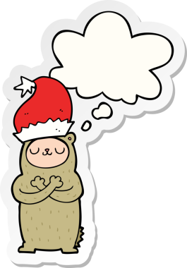 Bir insan tarafından çizilmiş bir çıkartma olarak düşünce baloncuklu Noel şapkası takan çizgi film ayısı.