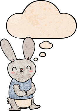 Bir insan tarafından çizilmiş grunge desenli düşünce baloncuklu şirin çizgi film tavşanı.