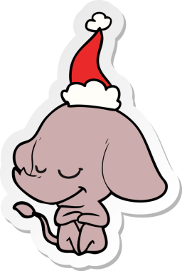 Bir insan tarafından çizilmiş Noel Baba şapkası takan gülümseyen bir filin el yazısı.