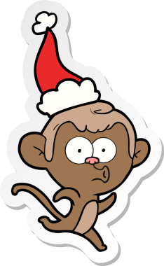 Bir insan tarafından çizilmiş Noel Baba şapkası giymiş şaşırmış bir maymunun el yazısı.