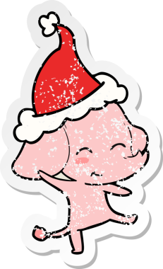 Sevimli bir el, bir insanın çizdiği Noel Baba şapkasıyla dans eden bir fil çıkartması çizmiş.