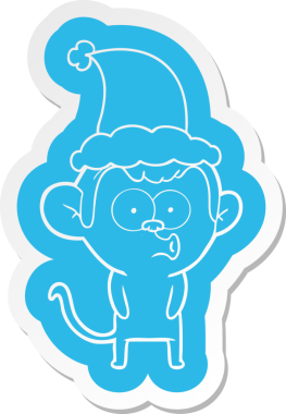 Bir insan tarafından çizilmiş Noel Baba şapkası giyen korna çalan bir maymunun garip çizgi film çıkartması.