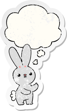 Düşünce baloncuğu olan sevimli çizgi film tavşanı bir insan tarafından çizilmiş yıpranmış bir çıkartma.