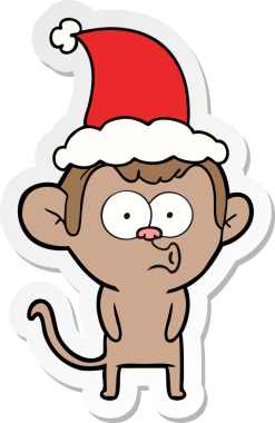 Bir insan tarafından çizilmiş Noel Baba şapkası giyen öten bir maymunun el yazısı.