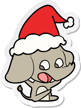 Bir insan tarafından çizilmiş Noel Baba şapkası takan bir fil çizimi.