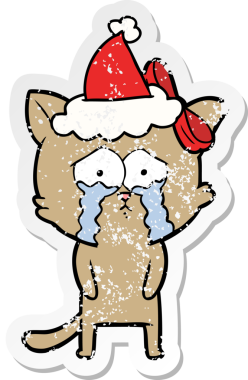 Bir insan tarafından çizilmiş Noel Baba şapkası takan bir kedinin çizilmiş el yazısı.