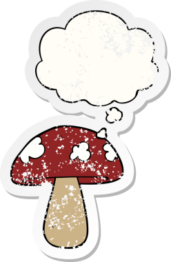 Düşünce baloncuğu olan karikatür mantarı insan tarafından çizilmiş yıpranmış bir çıkartma.