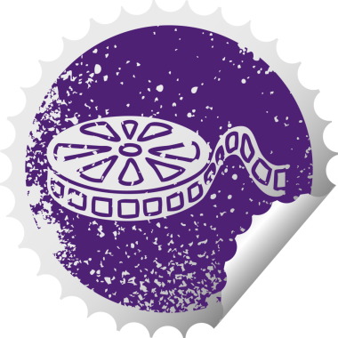 Bir insan tarafından çizilmiş bir film makarasının deforme olmuş dairesel soyma etiketi.