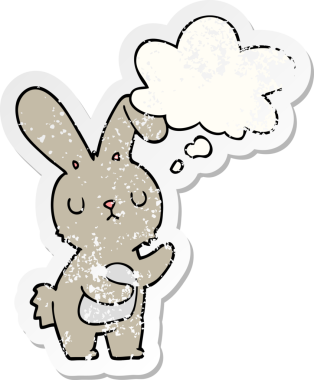 Düşünce baloncuğu olan sevimli çizgi film tavşanı bir insan tarafından çizilmiş yıpranmış bir çıkartma.