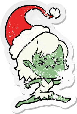 Bir insan tarafından çizilmiş Noel Baba şapkası takan vampir bir kızın gergin bir şekilde çizilmiş çıkartması.