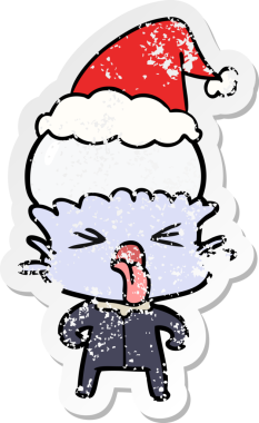 Bir insan tarafından çizilmiş garip bir el çizimi Noel Baba şapkası giymiş bir uzaylının karikatürü.