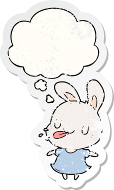 Düşünce baloncuğu olan çizgi film tavşanı insan tarafından çizilmiş yıpranmış bir çıkartma.