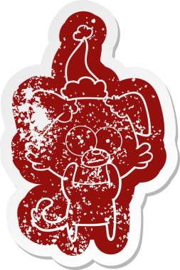 Sinirli köpek çizgi filmi, bir insan tarafından çizilmiş Noel Baba şapkasının çıkartması.