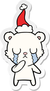 Ağlayan kutup ayısı eli bir insanın çizdiği Noel Baba şapkasının çıkartması.
