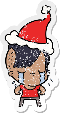 Bir insan tarafından çizilmiş Noel Baba şapkası giymiş ağlayan bir kızın el yazısı.