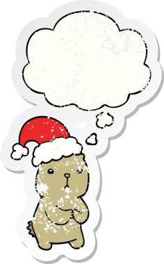 Düşünce baloncuğuyla endişelenen çizgi film Noel Ayısı bir insan tarafından çizilmiş yıpranmış bir çıkartma gibi