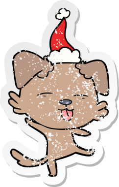 Bir insan tarafından çizilmiş Noel Baba şapkası giymiş dans eden bir köpeğin el yazısı.