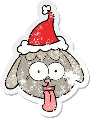 Bir insan tarafından çizilmiş Noel Baba şapkasıyla nefes nefese kalmış bir köpek yüzü çizilmiş.