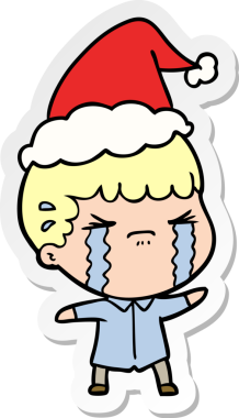 Bir insan tarafından çizilmiş Noel Baba şapkasıyla ağlayan bir adamın el yazısı.