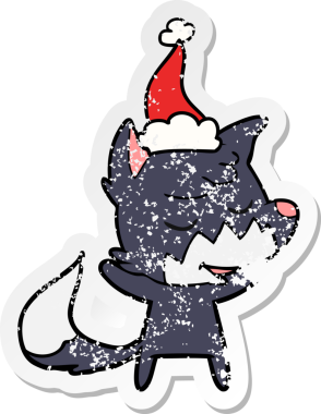 Bir insan tarafından çizilmiş Noel Baba şapkası takan bir tilki çizilmiş.