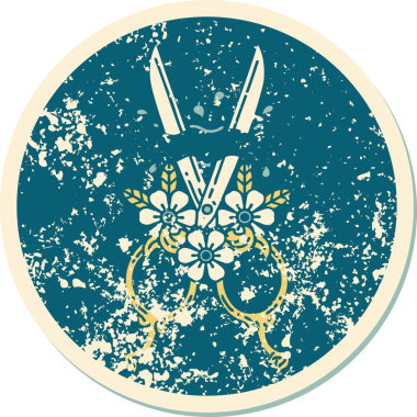 Bir insan tarafından çizilmiş berber makasının ve çiçeklerin sembolik dövmesi.