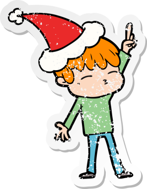 Bir insan tarafından çizilmiş Noel Baba şapkası giymiş meraklı bir çocuğun el çizimi karikatürü.