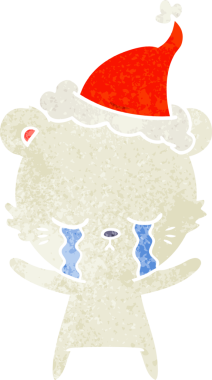 Ağlayan el, bir insan tarafından çizilmiş Noel Baba şapkası giyen bir kutup ayısının retro karikatürü.
