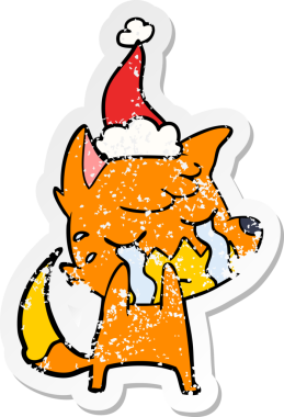 Ağlayan tilki eli, bir insan tarafından çizilmiş Noel Baba şapkasının üzgün çıkartması çizilmiş.