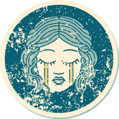 Bir insan tarafından çizilmiş ağlayan kadın yüzünün sembolik dövmeli görüntüsü.