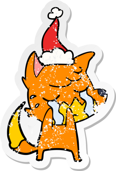Ağlayan tilki eli, bir insan tarafından çizilmiş Noel Baba şapkasının üzgün çıkartması çizilmiş.