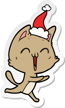 Mutlu el çizimi bir kedi miyavlıyor Noel Baba şapkası takıyor bir insan tarafından çizilmiş.
