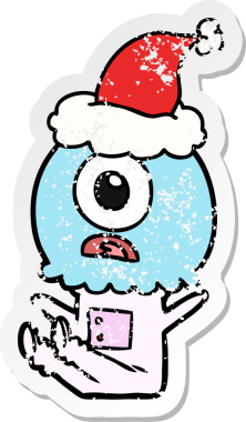 Bir insan tarafından çizilmiş Noel Baba şapkası giyen uzaylı bir Tepegöz 'ün kederli çıkartması.