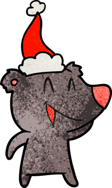 Gülen ayı eli desenli bir insan tarafından çizilmiş Noel Baba şapkası.