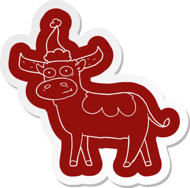 Bir insan tarafından çizilmiş Noel Baba şapkası takan bir boğanın garip çizgi film çıkartması.