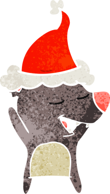 Bir insan tarafından çizilmiş Noel Baba şapkası giyen bir ayının el çizimi karikatürü.