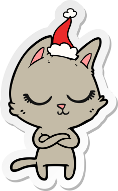 Sakin el çizimi bir insan tarafından çizilmiş Noel Baba şapkası takan bir kedi.