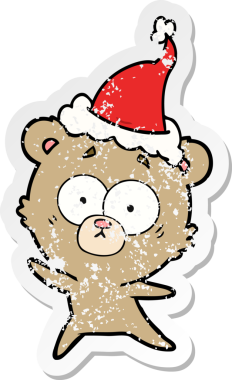 Endişeli ayı eli bir insan tarafından çizilmiş Noel Baba şapkası çizilmiş.