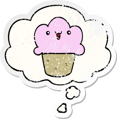 Yüzünde düşünce kabarcığı olan çizgi film keki insan tarafından çizilmiş yıpranmış bir çıkartma gibi.