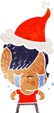 Bir insan tarafından çizilmiş Noel Baba şapkası giyen ağlayan bir kızın el çizimi karikatürü.