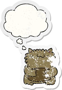 Düşünce baloncuğu olan çizgi film ayısı bir insan tarafından çizilmiş yıpranmış bir çıkartma.