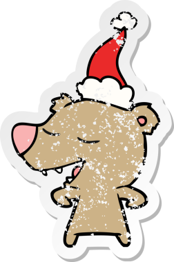 Bir insan tarafından çizilmiş Noel Baba şapkası takan bir ayının çizilmiş el yazısı.