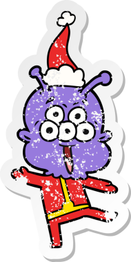 Mutlu el, bir insan tarafından çizilmiş Noel Baba şapkasıyla dans eden bir uzaylının kederli çıkartması.