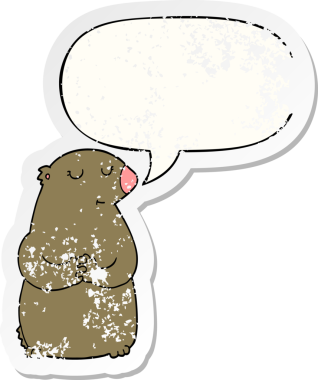 Konuşma baloncuğu olan sevimli çizgi film ayısı bir insan tarafından çizilmiş sıkıntılı eski bir çıkartma