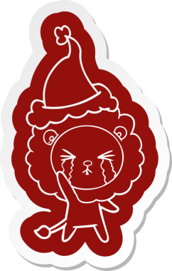 Bir insan tarafından çizilmiş Noel Baba şapkası takan ağlayan bir aslanın garip çizgi film çıkartması.