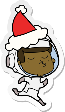 Bir insan tarafından çizilmiş Noel Baba şapkası giyen kendinden emin bir astronotun el yazısı.