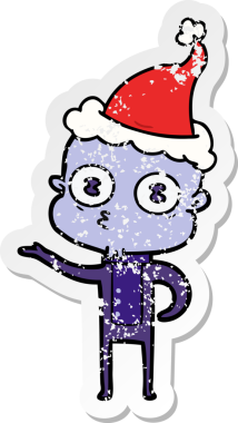 Bir insan tarafından çizilmiş Noel Baba şapkası giymiş garip kel bir uzaylının çizilmiş el yazısı.