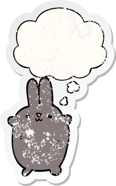Düşünce baloncuğu olan çizgi film tavşanı insan tarafından çizilmiş yıpranmış bir çıkartma.